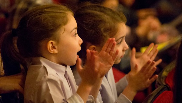 Children applaud a Hubbard Street 2 family matinée at Symphony Center. Photo by Todd Rosenberg.