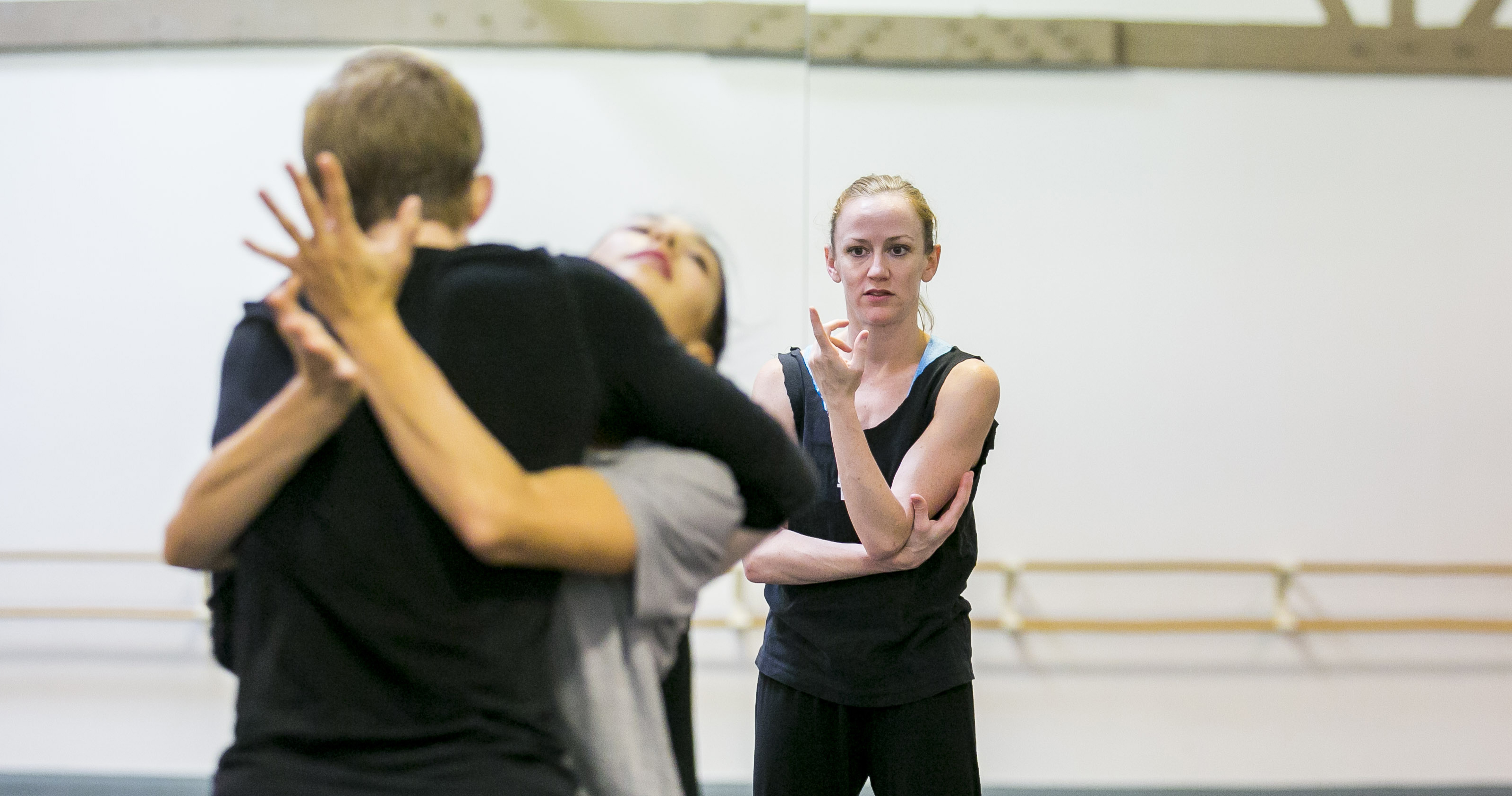 Choreographer Penny Saunders, right, in rehearsal with recently promoted dancers Elliot Hammans, foreground, and Adrienne Lipson. Photo by Todd Rosenberg.