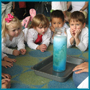 Kids watching an experiment