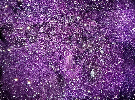 A large, purple amethyst geode