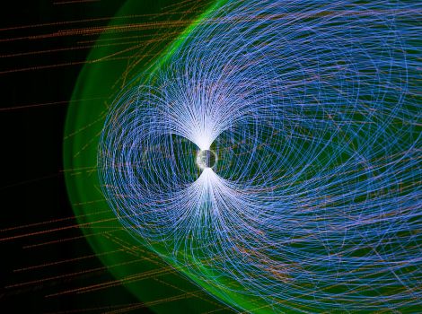 Colored lines in different patterns are used to depict Earth's protective magnetic field.