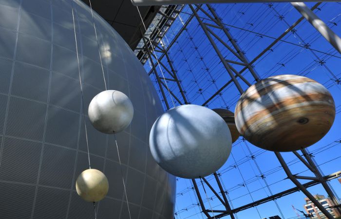 Scale models of planets by the Hayden Sphere.
