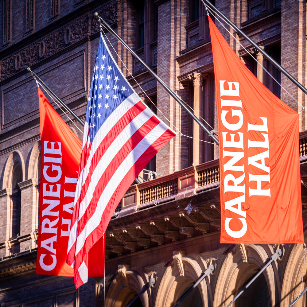  Carnegie Hall exterior shot with Carnegie Hall and USA flags by Chris Lee