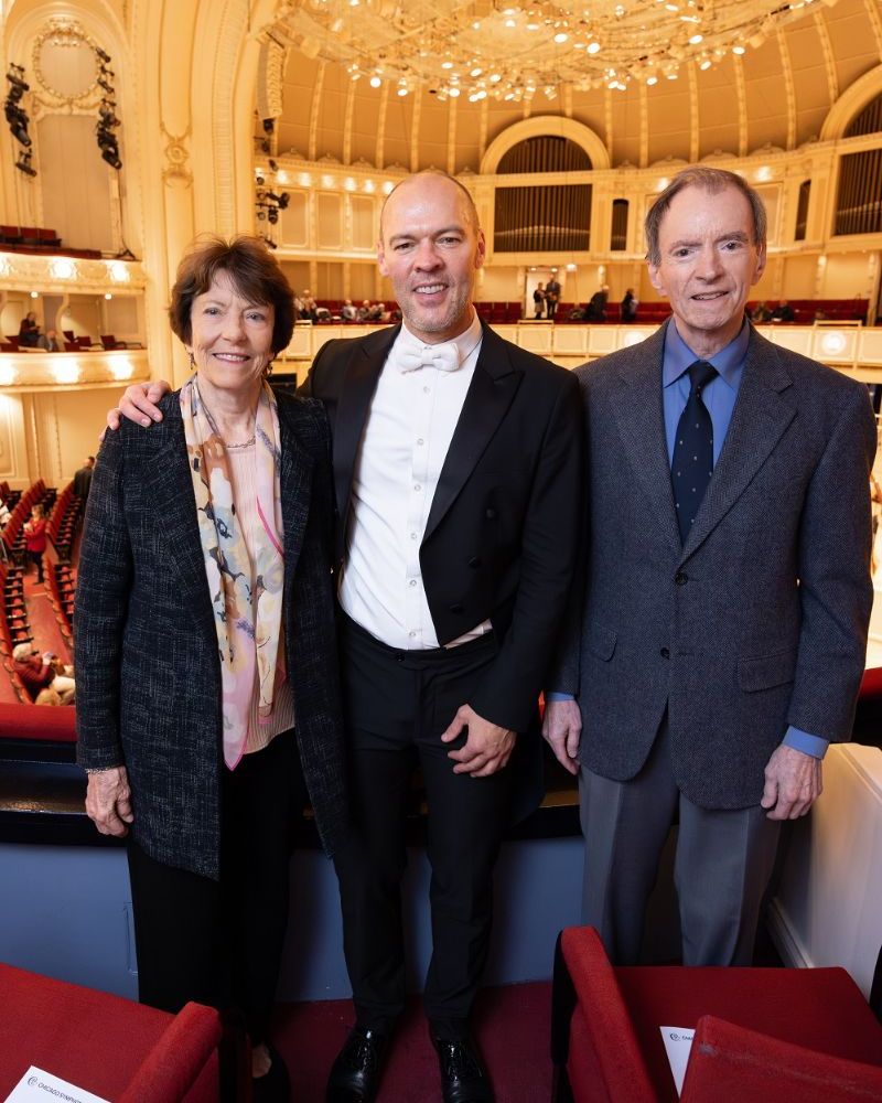 Ann and Roger Blickensderfer stand with CSO cello Brant Taylor (center), holder of the Blickensderfer Family Chair.