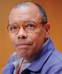man with glasses and blue shirt