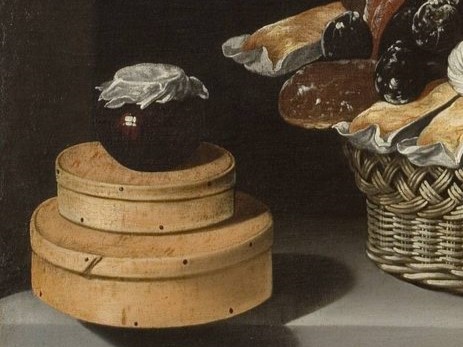 a jar of marmalade on top of circular boxes