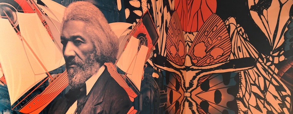 A detail from the custom wallpaper for the Imprints in Time exhibition, featuring Frederick Douglass, ships, and butterfly wings, among other items