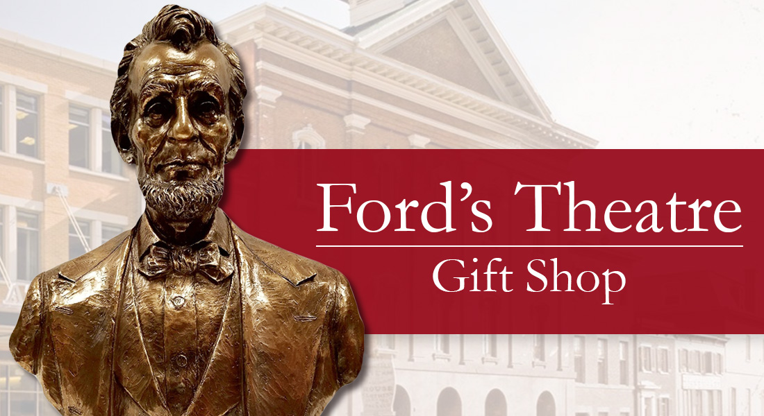 Small, copper bust of Abraham Lincoln in front of a grayed-out exterior image of Fords Theatre. Link to shop now.