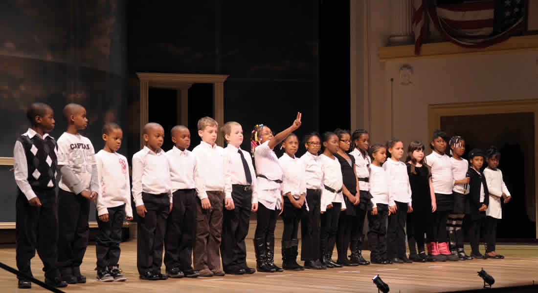 Photo of students on stage participating in the Lincoln Oratory Festival at historic Ford's Theatre. Photo by Gary Erskine. Link to apply.