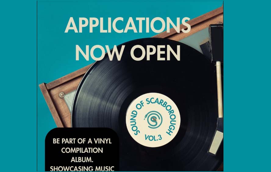 A vinyl disk is in the centre of the image with the wording 'Applications now open' above, written in beige against a blue background