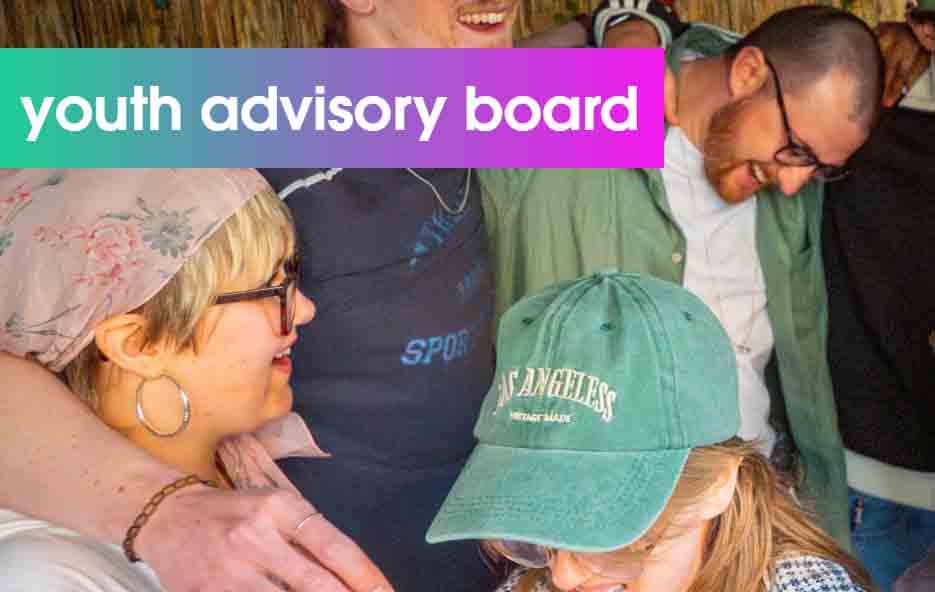 A group of people are seen laughing and smiling, looking at each other. The wording 'Youth Advisory Board' is above, written in white