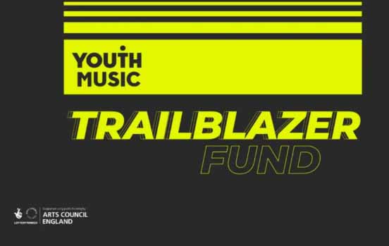 The Youth Music logo is at the top of the image written in black against a yellow background. Below, the words 'Trailblazer Fund' are written in yellow against a black background