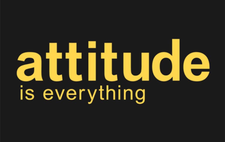 The wording 'attitude is everything' is written in yellow against a black background