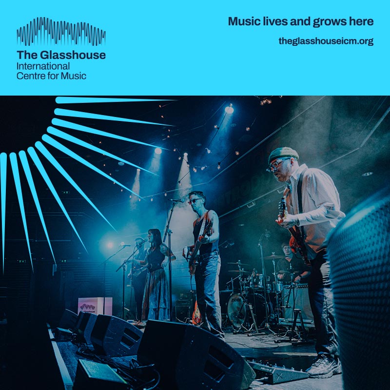 PØRTERS: a band of five people are performing on stage with blue lighting behind them. 