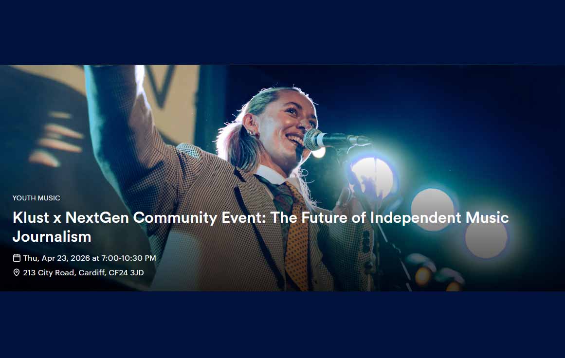 A young girl is smiling and talking into a microphone