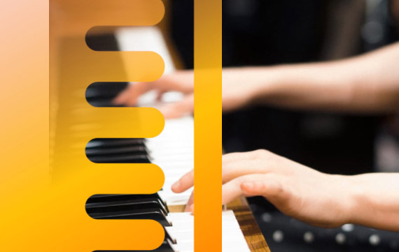Two hands are seen playing a piano
