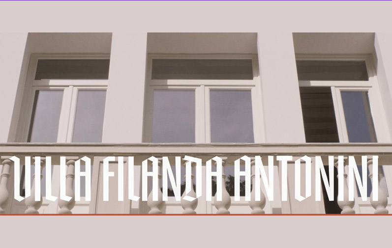 Three windows are seen and a balcony