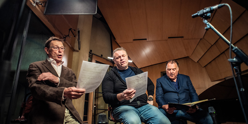 Simon, Joseph and Bryn, holding music