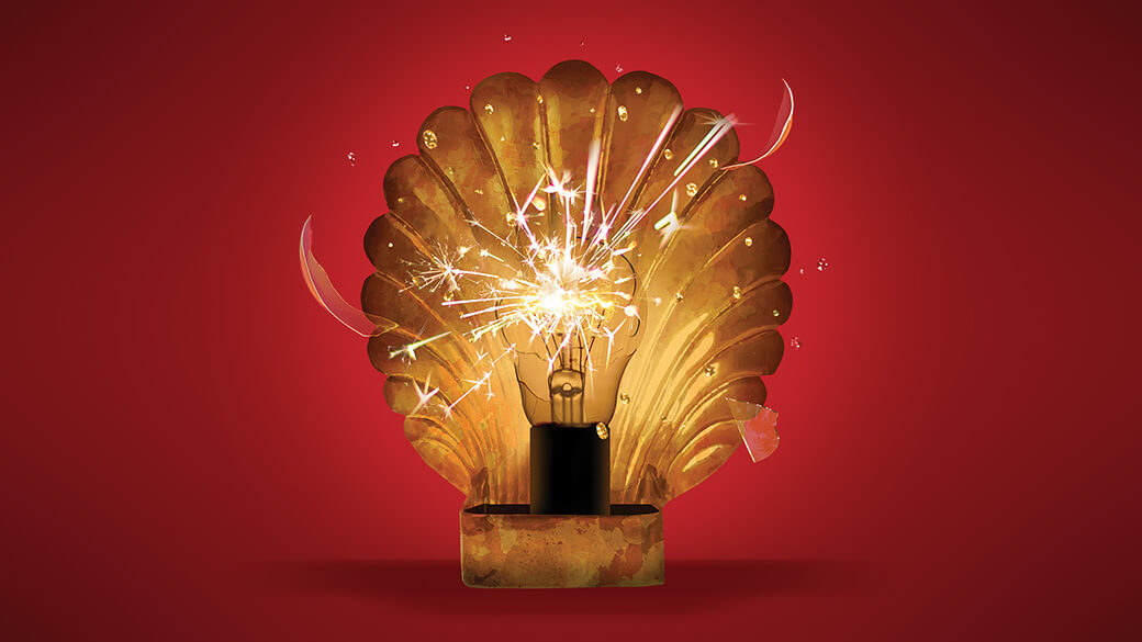 A lightbulb sparks and shatters in front of a shiny gold shell on a red background