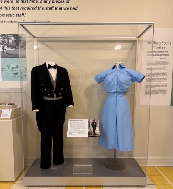 New display with men's and women’s staff uniforms.