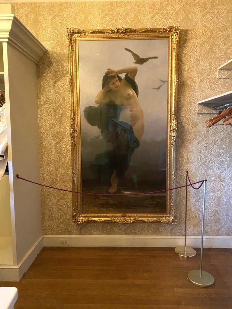 Stanchions help protect La Nuit in the coat check.