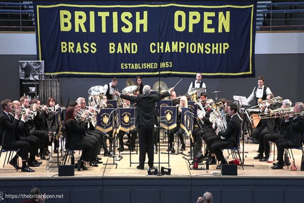 Members of the Rothwell Temperance Band in black concert dress mid-performance.