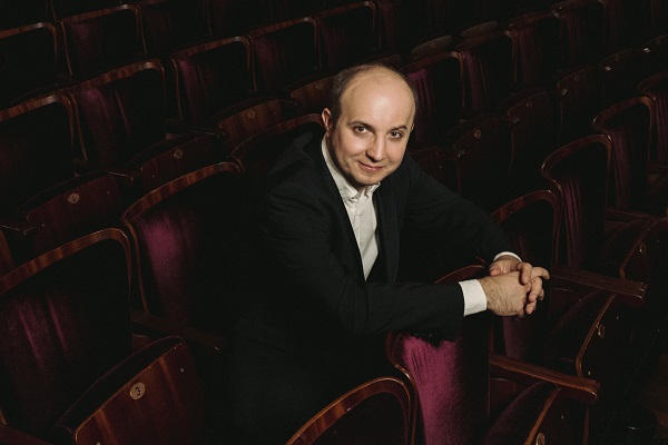 Pianist Alexander Gavrylyuk in concert dress in a theatre
