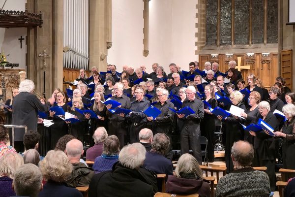 The members of Leeds Festival Chorus performing in a church.