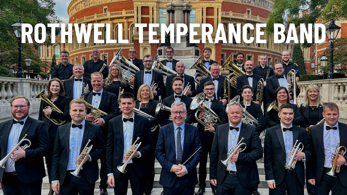 Members of the Rothwell Temperance Band in black concert dress with their instruments on the steps by the Royal Albert Hall.