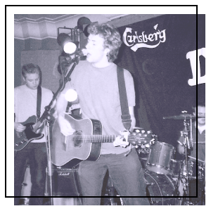 A musician playing in front of a crowd