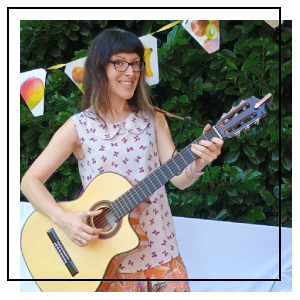 A musician playing in front of a crowd