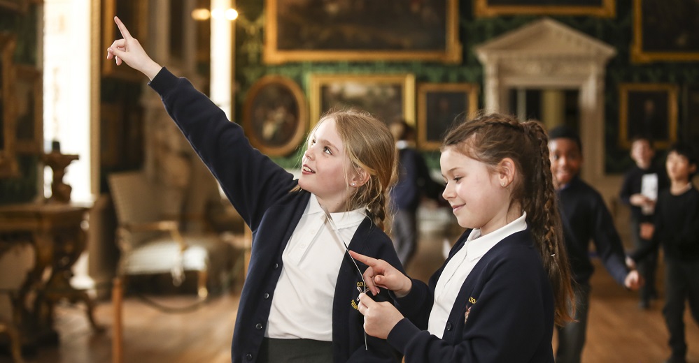 Two schoolgirls pointing
