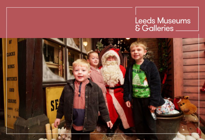 Mum holding a baby dressed in a Halloween costume