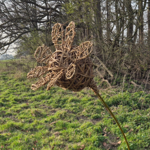 poppy seedhead shaped willow sculpture