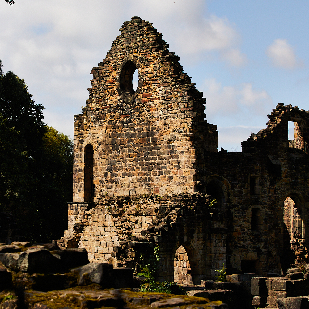 The ruins of Kirkstall Abbey showing the round window