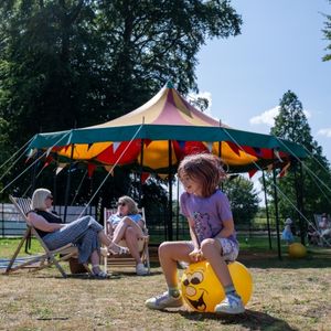 A child on a yellow spacehopper