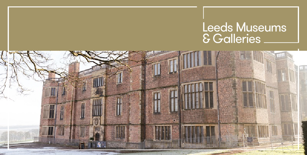 Mum holding a baby dressed in a Halloween costume