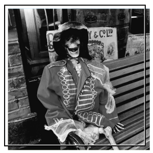skeleton on a bench in the victorian streets