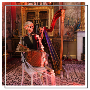 skeleton playing an accordion and a harp