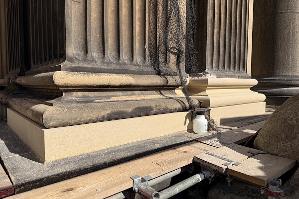 New hard Yorkstone installed at the base of the columns.