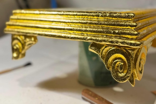 24ct gold leaf repairs on the ironwork.