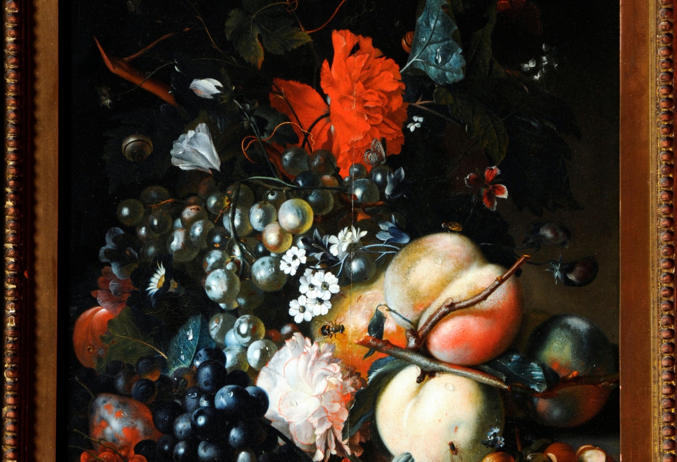 A framed oil painting of fruit