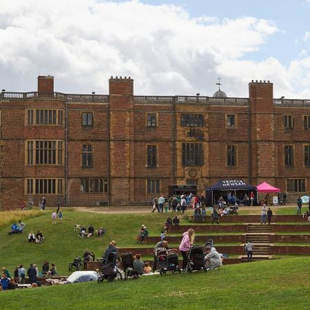 A large group of people outside Temple Newsam house
