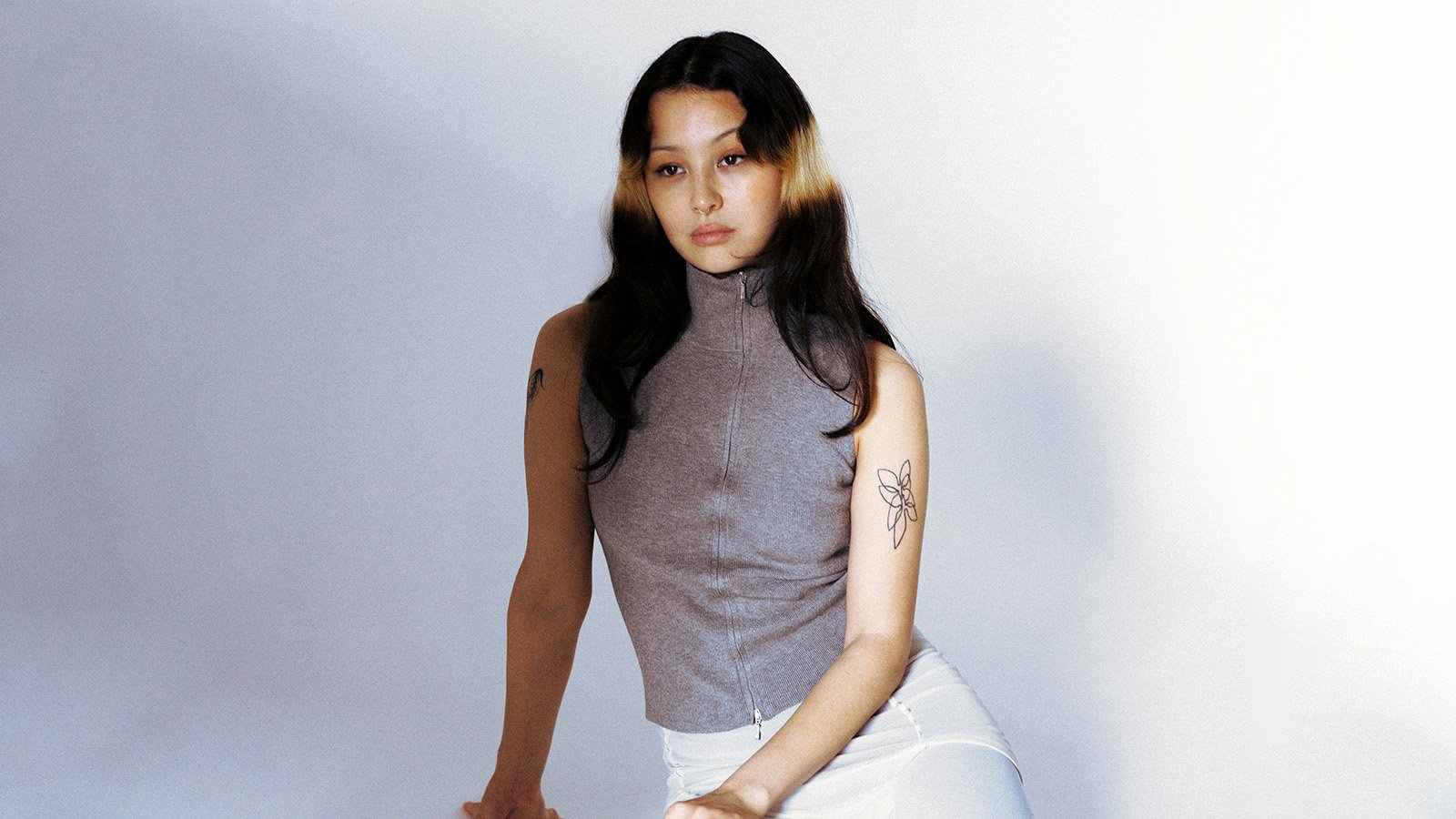 Luna Li poses in ethereal lighting