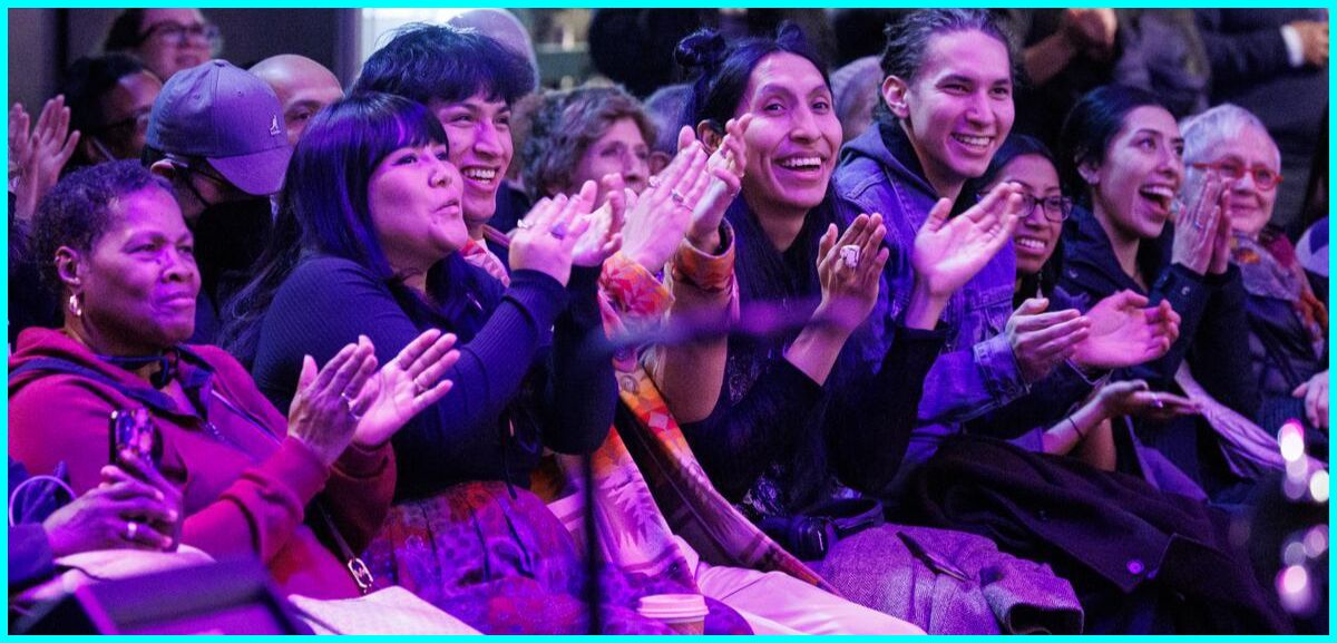 Audience watching a performance at the Atrium
