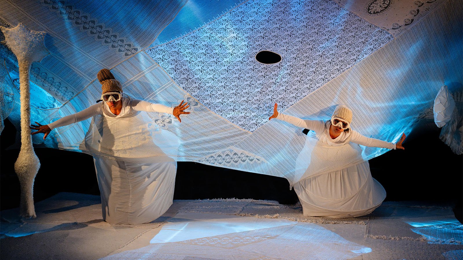 two artists in white set