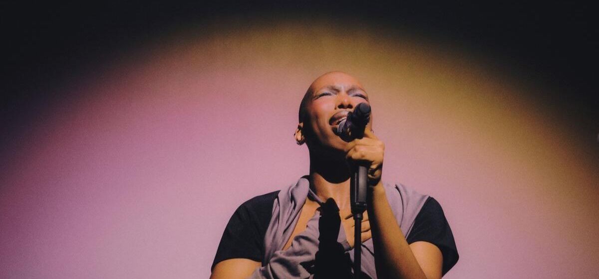 Lambkin performs under moody purple lighting. Photo by Lawrence Sumulong