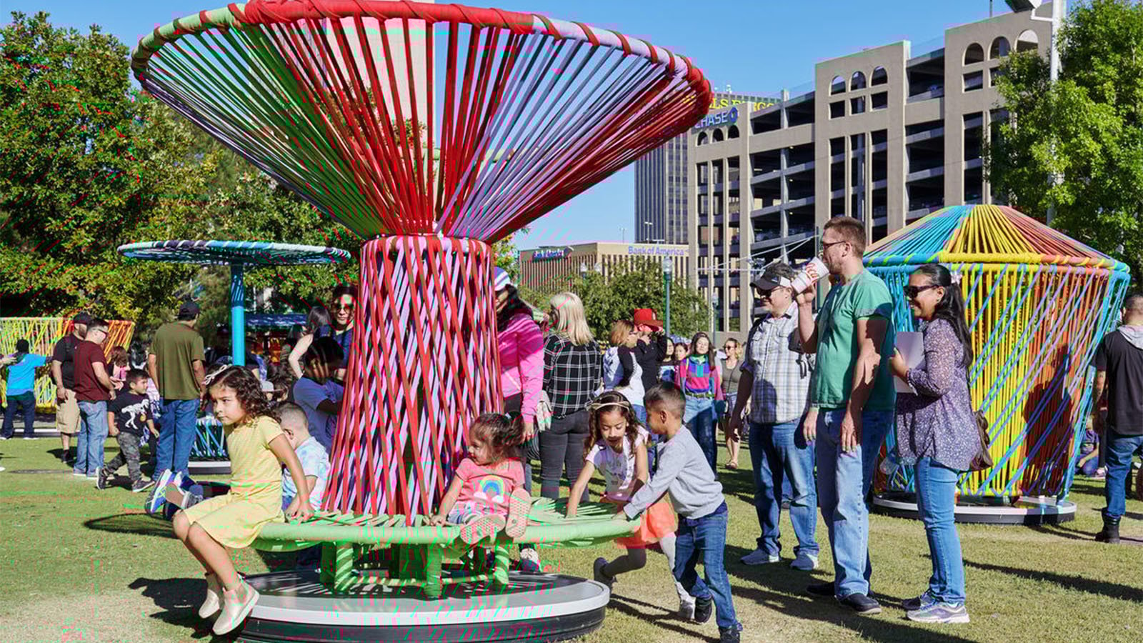 Kids and families interact with Los Trompos 