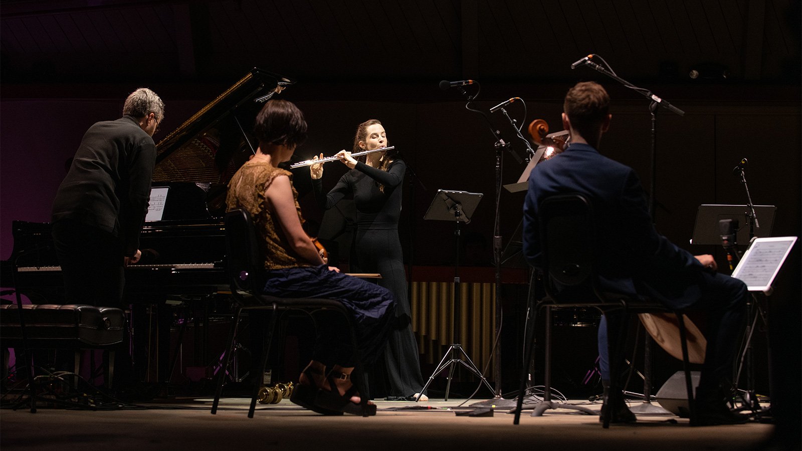 woman speaking into a mic