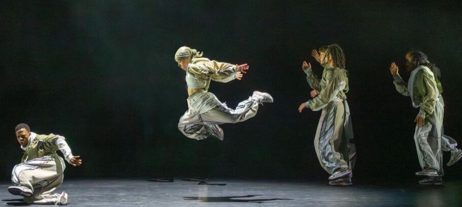Boy Blue, a dance troupe, strikes a pose on stage